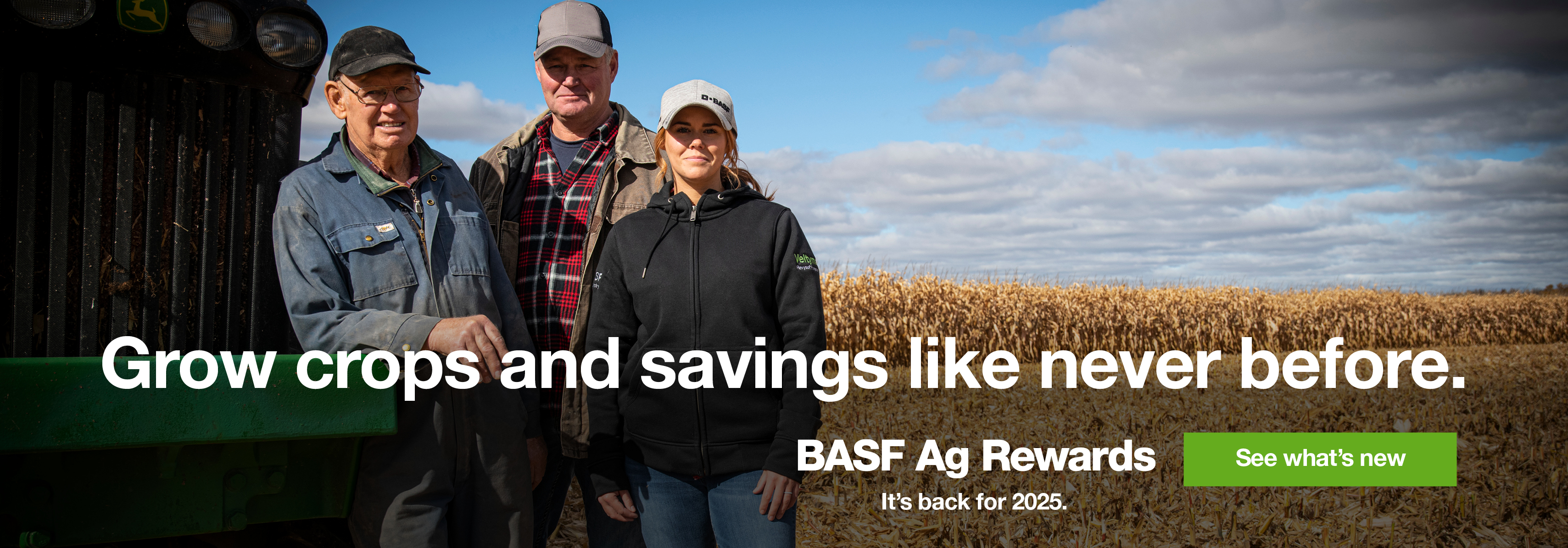 Three farmers smiling in field