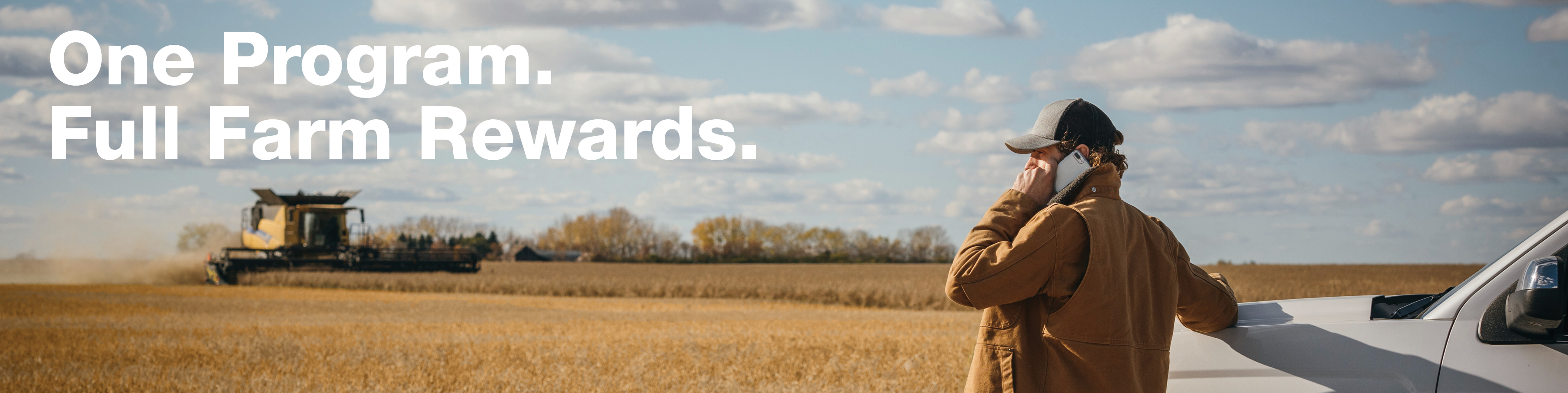 Farmer in field talking on the phone