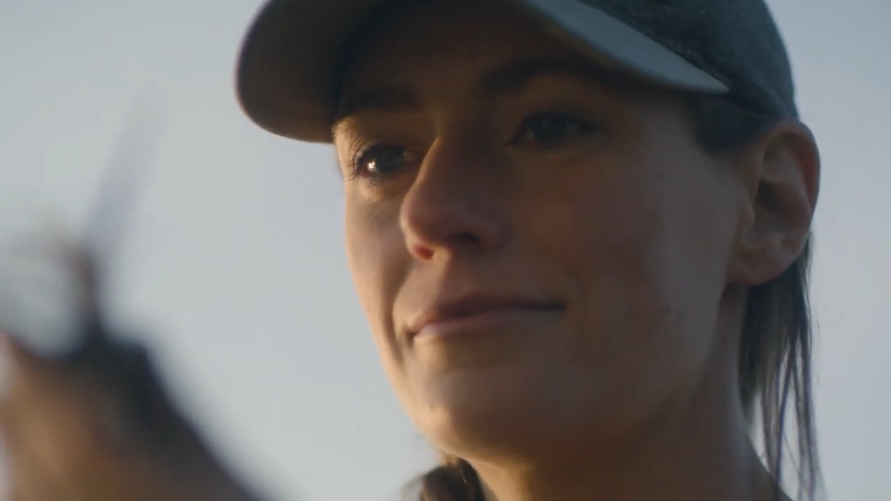 Close up of woman examining crop
