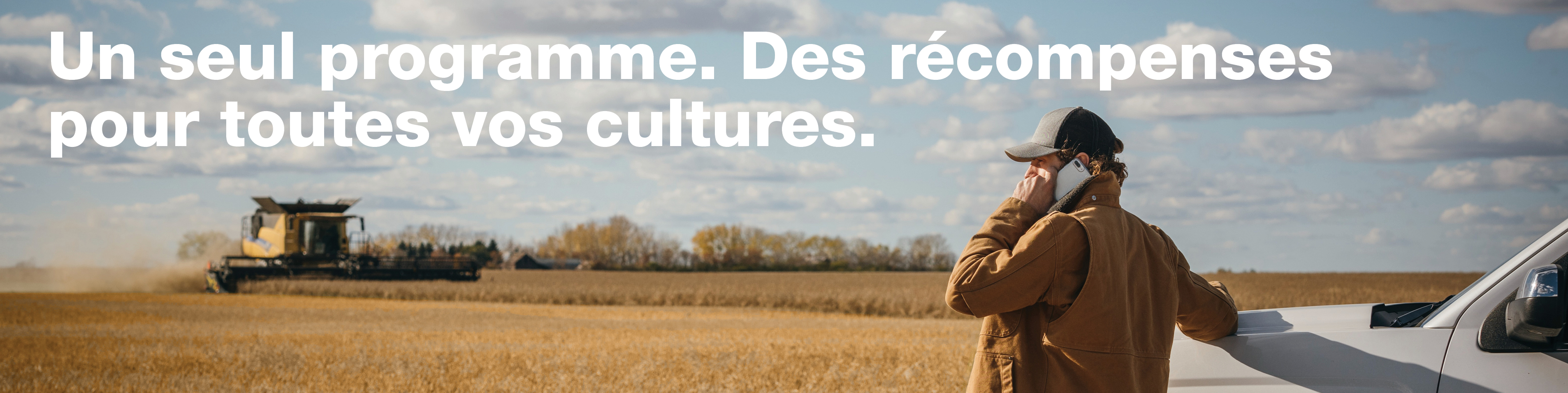 Farmer in field talking on the phone