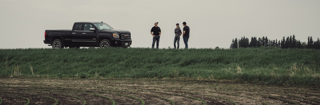 Farmers standing in field